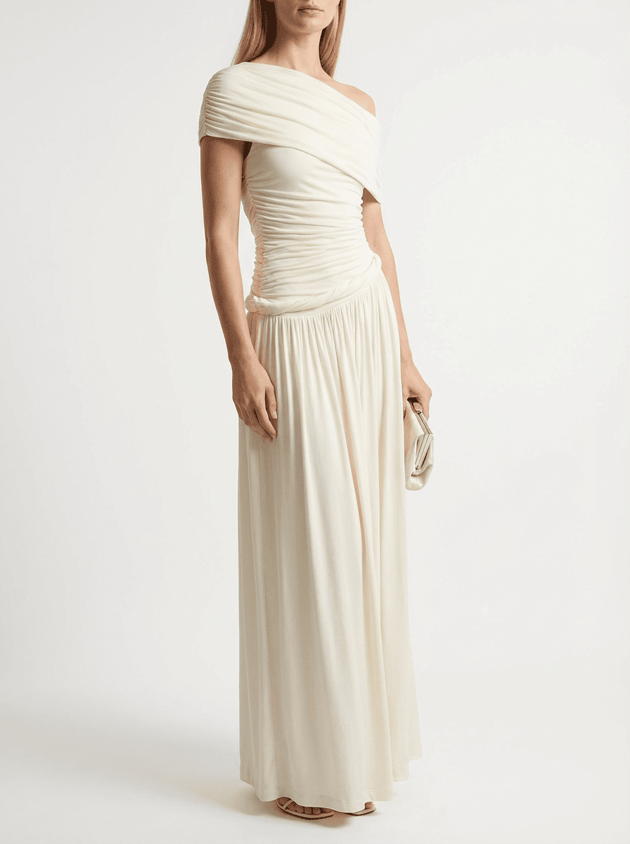 Ivory Off-Shoulder Draped Maxi Dress by COCOSIN