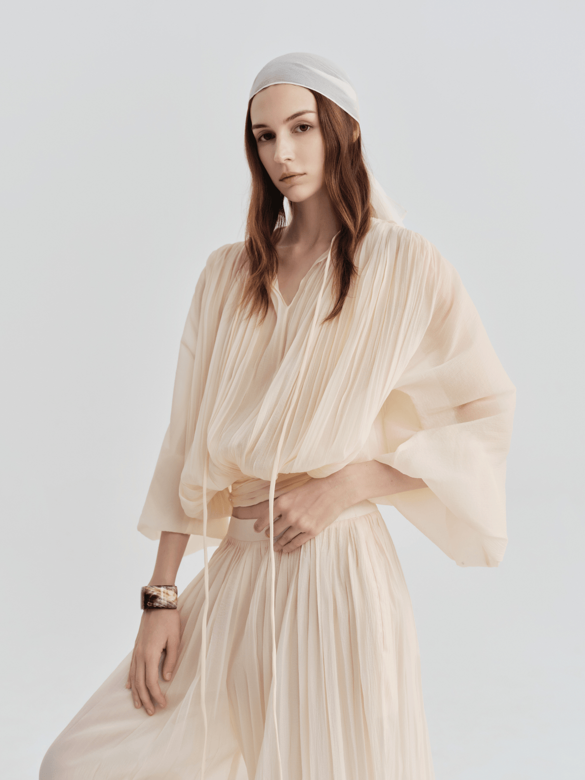 Sheer Pleated Blouson Top by COCOSIN